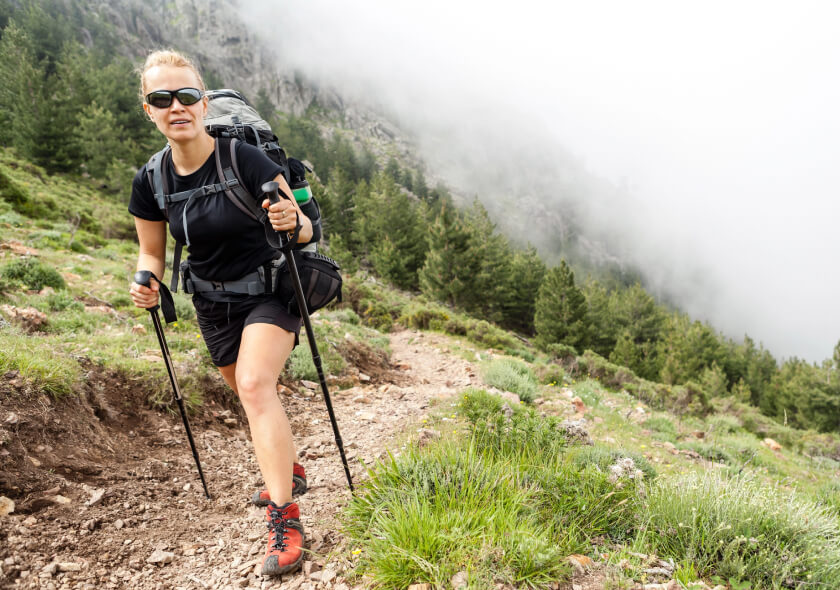 hiking with backpack in mountains